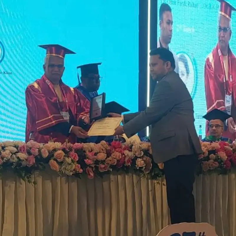 Dr. MKB Tanveer receiving a prestigious crest and certificate at the 27th International Pain Conference at Hotel InterContinental, Dhaka